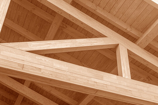 Wooden roof structure. Glued laminated timber roof. Rafters made of wood.