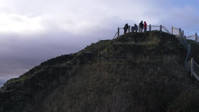 Hikers on top of Sandal castle ruins motte 