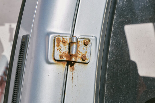 rusty hinge on car door