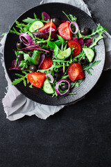 vegetable salad tomato, arugula, lettuce, olives vegetables fast food ready to eat portion on the table for healthy meal snack outdoor top view copy space for text food background rustic image keto