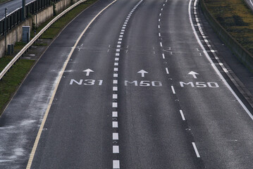 Close up aerial view of N31 M50 road signs on M50 road in Dublin, Ireland. Empty motorway during...