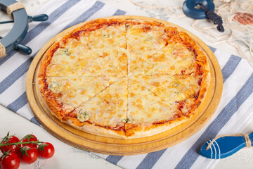 Classic Italian pizza margarita on a wooden board.