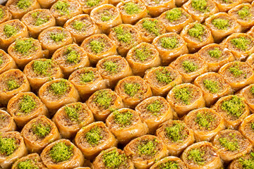 Sweet Turkish baklava with pistachio. Conceptual background.