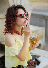 young woman with glass of wine