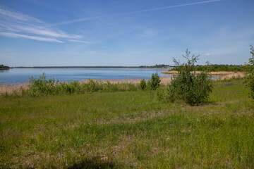 Panorama of renaturized brown coal open pit landscape with the lake Grosser Goitzschesee near the town of Bitterfeld, Germany, Europe