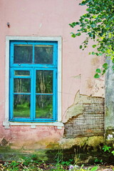 Fototapeta na wymiar Blue window on vintage wall background