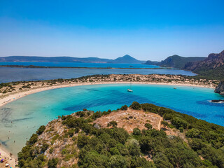 Aerial panorama view of the famous semicircular sandy beach and lagoon of Voidokilia in Messenia, Greece