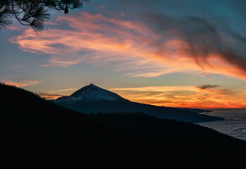 Sunset with a snowy mountain