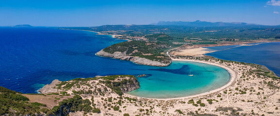 Fototapeta premium Aerial panorama view of the famous semicircular sandy beach and lagoon of Voidokilia in Messenia, Greece