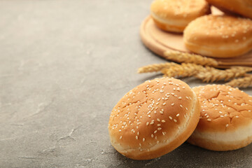 The burger buns with spikelet on a grey background.