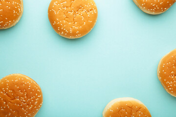 The burger buns on a blue background.