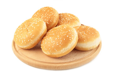 Burger buns on cutting board isolated on a white background.