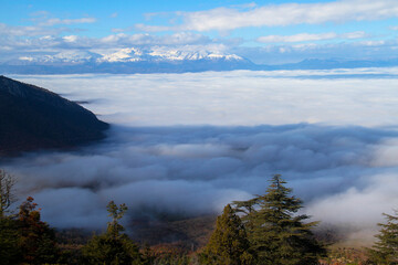 Fototapeta na wymiar Clouds over the mountains, mist over the mountains, fog over the mountains, sky with clouds