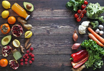 Healthy clean eating, plant based layout, vegetarian food and diet nutrition concept. Various fresh vegetables ingredients for cooking on dark wooden table background, top view, frame, banner