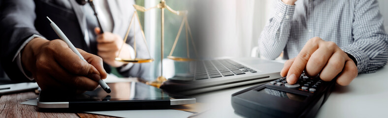 Business and lawyers discussing contract papers with brass scale on desk in office. Law, legal services, advice, justice and law concept picture with film grain effect