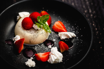Vanilla Panna Cotta served with fresh Rutland strawberries, meringue shards and raspberry coulis
