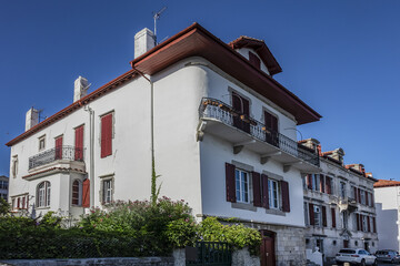 Traditional red and white Basque houses - typical architecture of Saint Jean de Luz, Pyrenees-Atlantiques department in southwestern France.