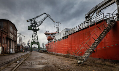 cargo ship in port - obrazy, fototapety, plakaty