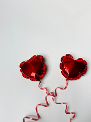 Red balls hearts on white background
