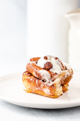 Cinnamon rolls having been baked - with cream cheese frosting