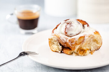Cinnamon rolls having been baked - with cream cheese frosting