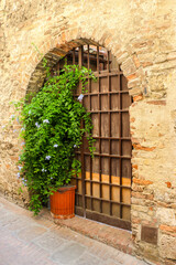 Fototapeta na wymiar San Gimignano, Italy. Beautiful architecture of San Gimignano, small city in Toscana region.