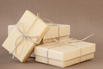 Holiday ecological gift boxes on brown background