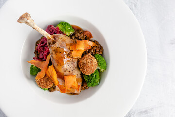 Confit duck leg with seasonal vegetables