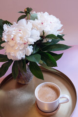 White peonies and fresh coffee