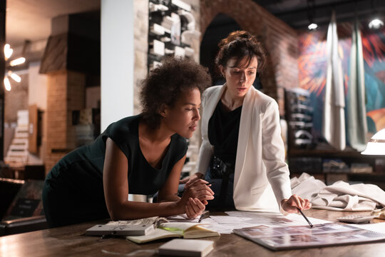 Diverse architects discussing project in office