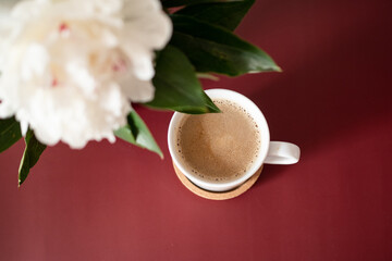 White peonies and fresh coffee