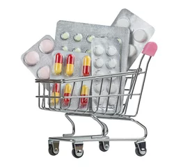 Fototapete Süße Monster Einkaufswagen gefüllt mit Pillen auf weißem Hintergrund.