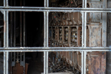 The interior of an old vacant building, damaged electrical appliances.
