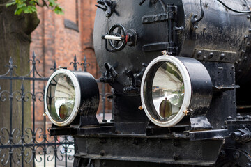 Fototapeta na wymiar The front of an old steam train.