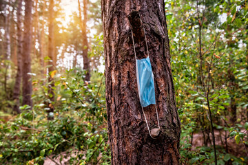 medical face mask in the forest
