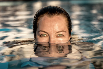 woman swims in the pool