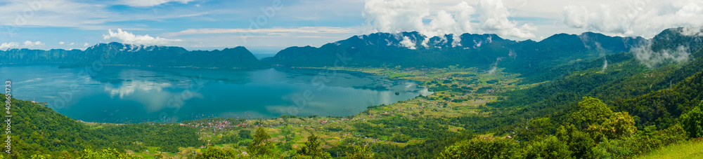 Wall mural Super wide panoramic view of Maninjau Lake at West Sumatra, Indonesia. Beautiful nature Indonesia landscape with mountains background.