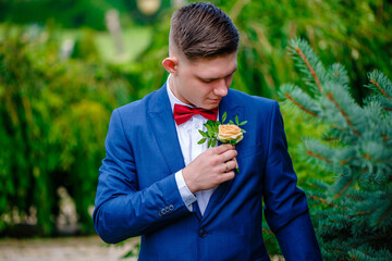 Red bow tie with white shirt closeup