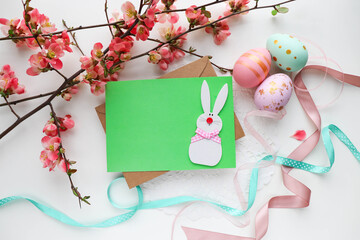 Easter card mockup. spring flowers, easter eggs, willow twigs and space for text 