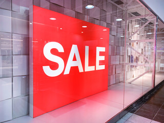 Sale banner in the window of a retail store