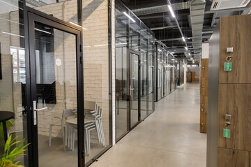 Modern empty office with glass partitions, loft style interior. Perspective view
