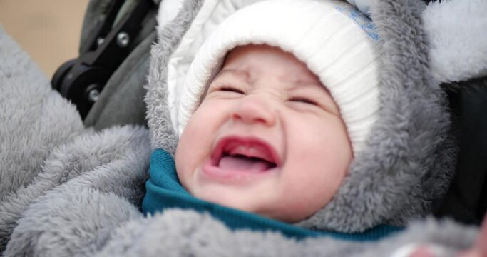 baby boy crying and not sitting in car stroller