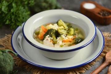 Diet turkey fillet soup with broccoli, onions, carrots and asterisk pasta.