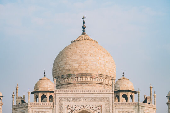Taj Mahal dome from the distance against hazy sky, Agra.