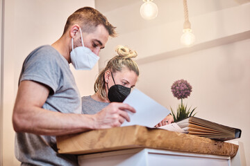 Fototapeta premium Couple of physiotherapists working on a wooden table with their documents