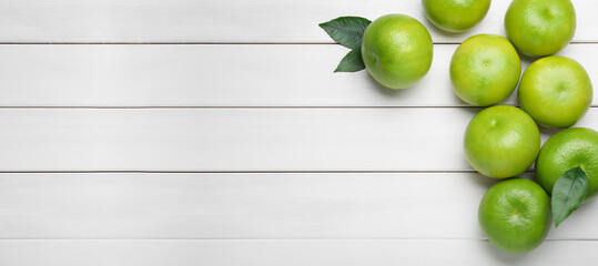 Fresh ripe sweeties on white wooden table, flat lay. Space for text