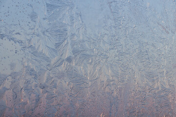 Beautiful frosty window as background, closeup. Winter morning