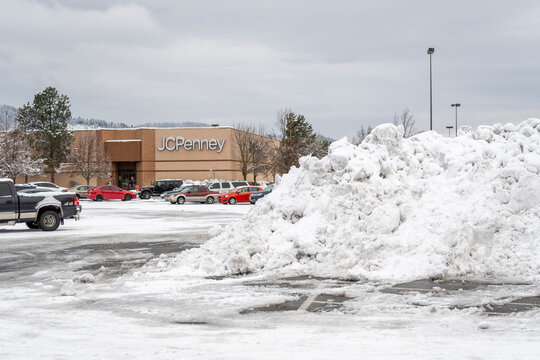 Parking lot view of the JC Penney sign and facade on a snowy winter day in Coeur d'Alene, Idaho, on January 11 2020.