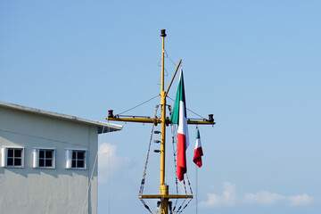Mast and maritime flag at port of Cozumel Mexico 