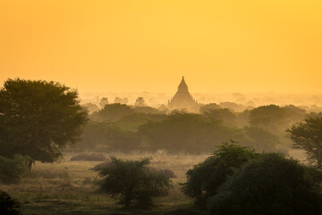 Pagoda against clear orange sky during sunrise, UNESCO, Bagan, Myanmar